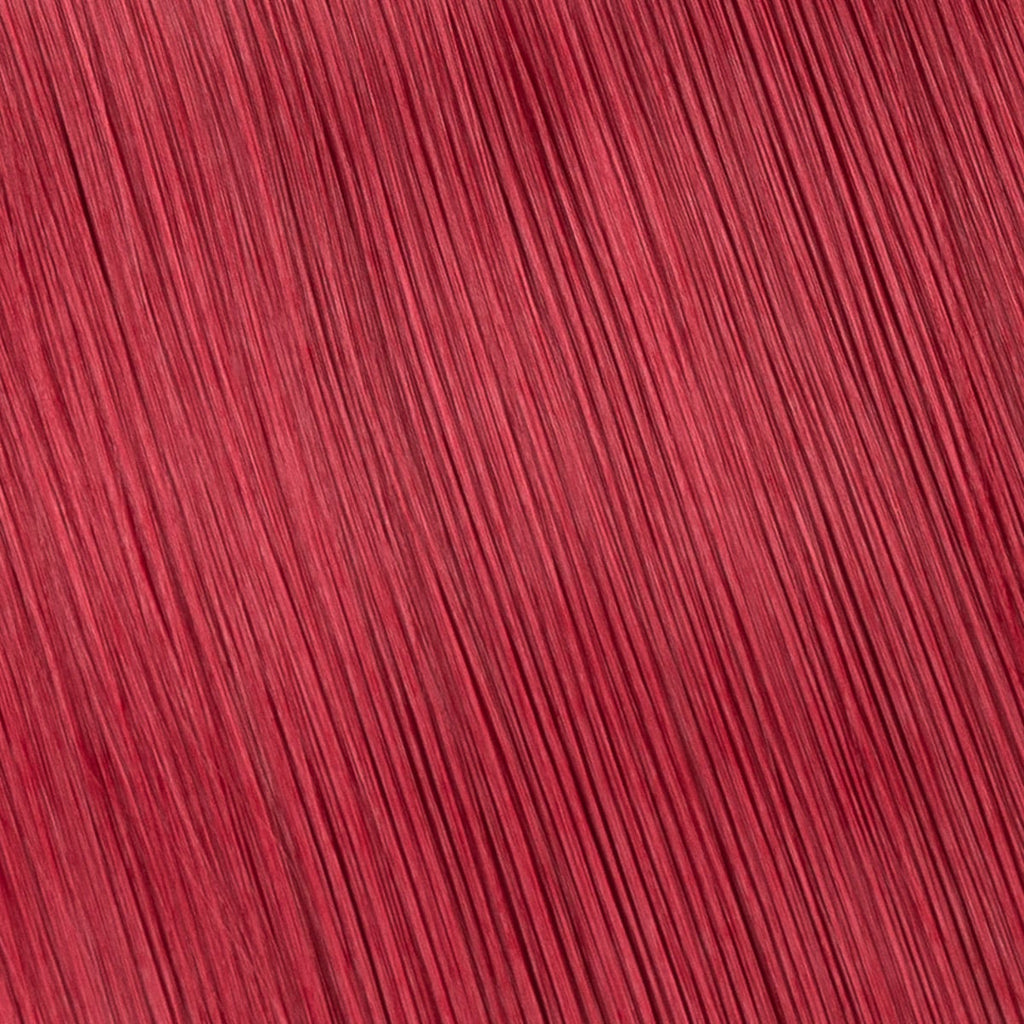 Närbild på färgprov från hårförlängningars färgkarta, som visar nyans och textur för att hjälpa dig välja rätt färg.
